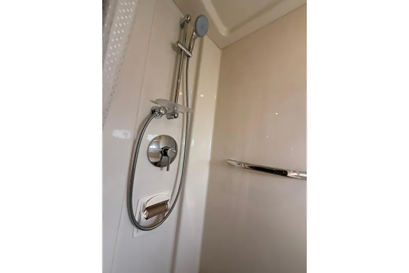 Slide: The Image of Shower area in 2014 Sea Ray 470 Sundancer yacht, featuring modern fixtures. - 84