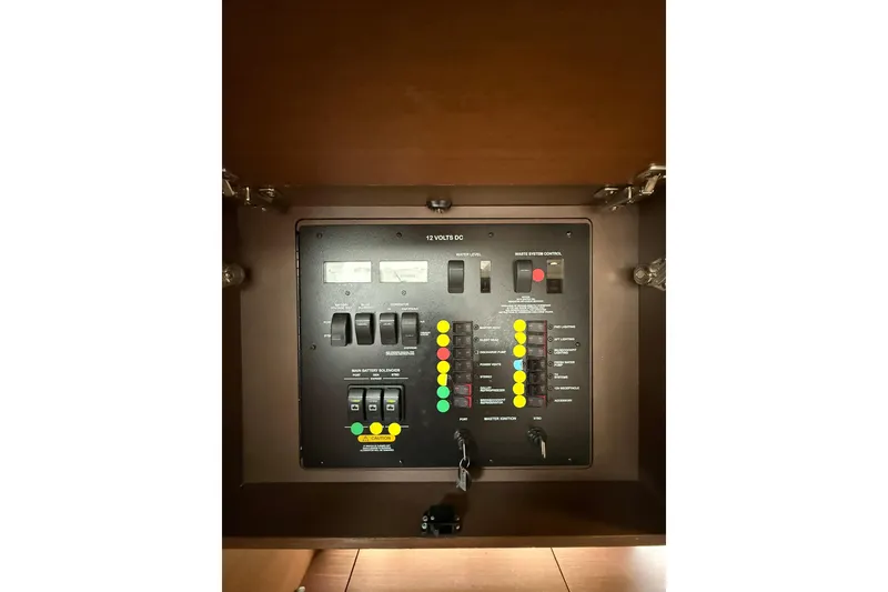 Slide: The Image of Control panel of a 2014 Sea Ray 470 Sundancer yacht, featuring switches and indicators. - 87