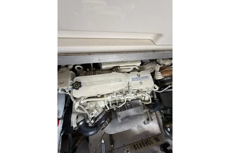 Slide: The Image of Engine compartment of 2014 Sea Ray 470 Sundancer with Cummins engine visible. - 92