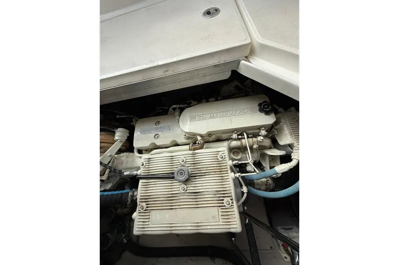 Slide: The Image of Engine compartment of a 2014 Sea Ray 470 Sundancer boat, featuring Cummins components. - 93