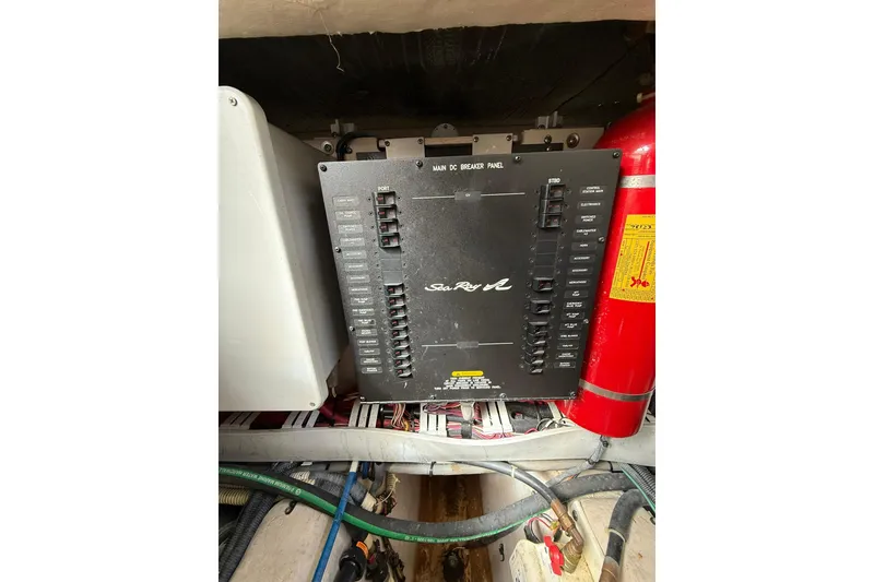 Slide: The Image of Electrical panel of 2014 Sea Ray 470 Sundancer boat, featuring circuit breakers and wiring. - 95
