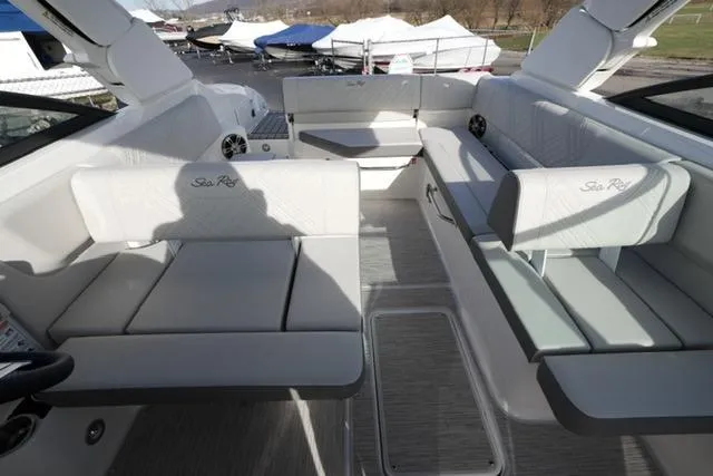 Slide: The Image of 2025 Sea Ray SDX 270 boat interior with spacious seating and modern design. - 18