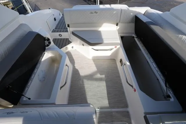 Slide: The Image of 2025 Sea Ray SDX 270 boat interior with spacious seating and storage compartments. - 19