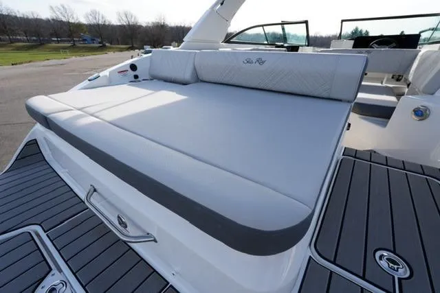 Slide: The Image of 2025 Sea Ray SDX 270 boat with spacious sunpad and sleek design. - 8