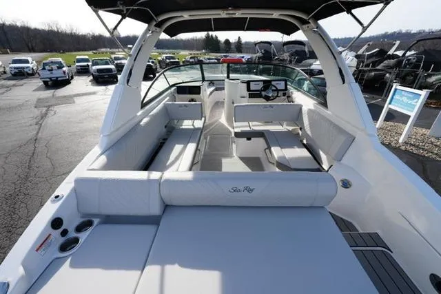 Slide: The Image of 2025 Sea Ray SDX 270 boat interior with spacious seating and modern design. - 9