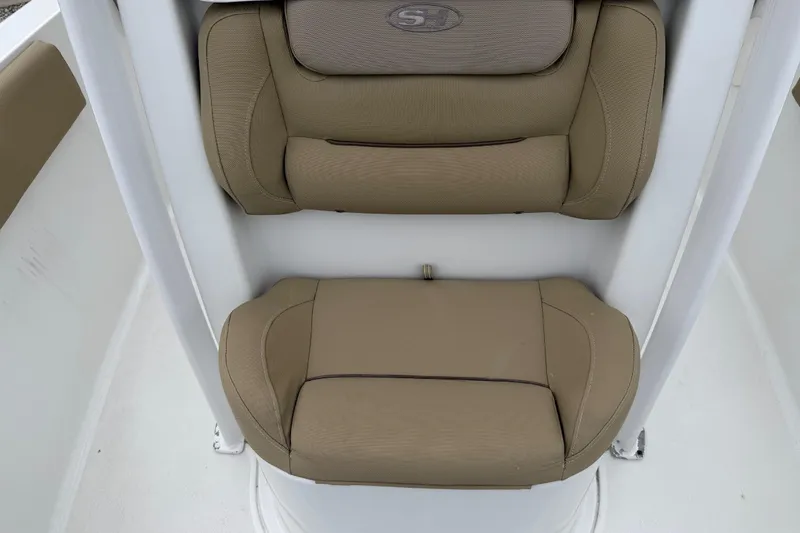Slide: The Image of 2016 Sea Hunt Ultra 234 boat seating with tan cushions. - 23