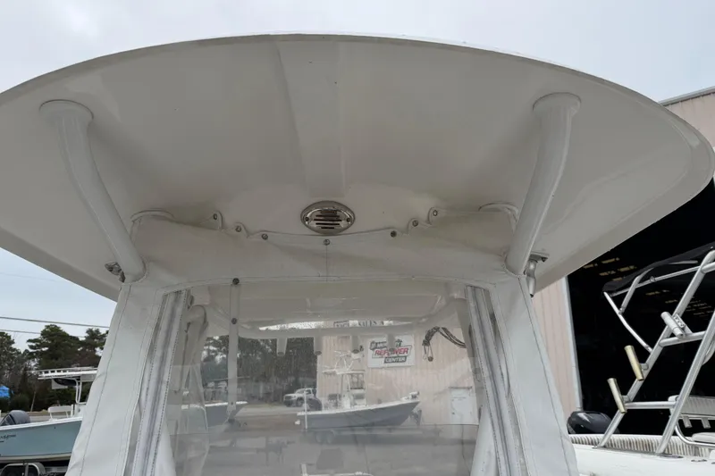 Slide: The Image of 2016 Sea Hunt Ultra 234 boat canopy and windshield detail. - 24