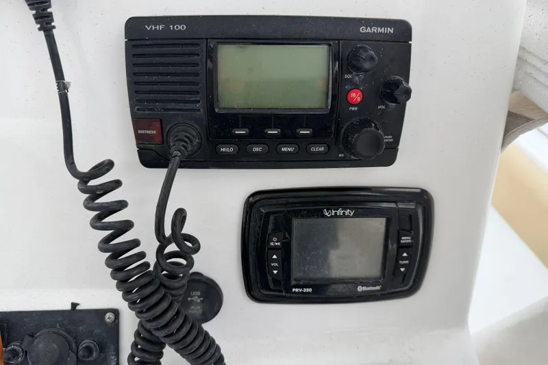 Slide: The Image of 2016 Sea Hunt Ultra 234 boat console with Garmin VHF 100 and Infinity PRV-350. - 27