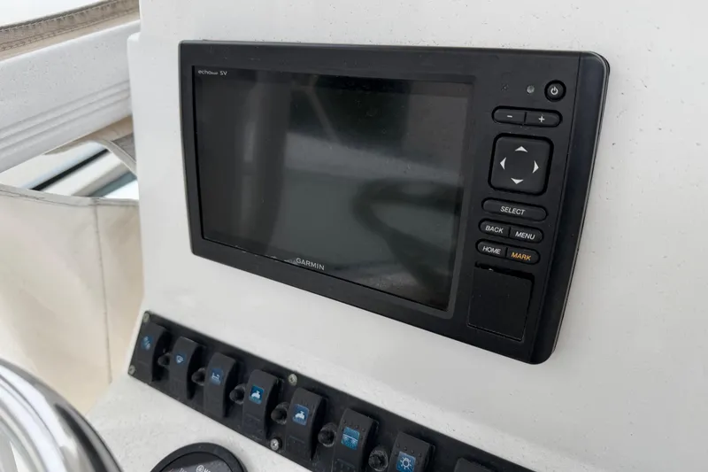 Slide: The Image of 2016 Sea Hunt Ultra 234 boat dashboard with Garmin navigation system. - 28