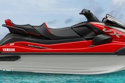 The Image of 2026 Yamaha WaveRunner VX Cruiser in red, floating on clear blue water. - 1