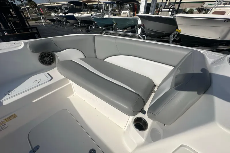 Slide: The Image of 2022 NauticStar 203 SC boat interior with gray seating and speaker. - 11