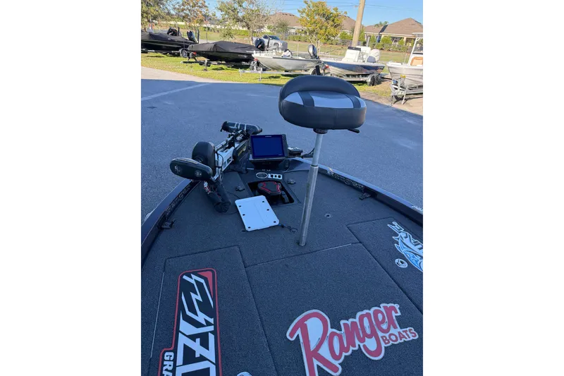 Slide: The Image of 2018 Ranger Z520L boat interior with dual seats and navigation equipment. - 11
