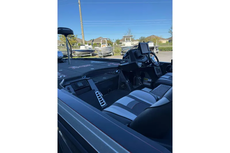 Slide: The Image of 2018 Ranger Z520L boat dashboard with Lowrance HDS12 display and steering wheel. - 12