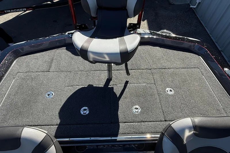 Slide: The Image of 2018 Ranger Z520L boat deck with seating and storage compartments. - 14