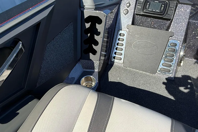 Slide: The Image of 2018 Ranger Z520L boat interior with cup holder and control panel. - 16