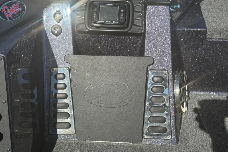 Slide: The Image of 2018 Ranger Z520L boat dashboard with control panel and logo. - 17