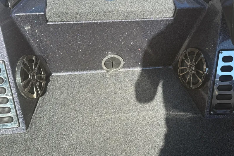 Slide: The Image of 2018 Ranger Z520L boat interior with speakers and textured flooring. - 18