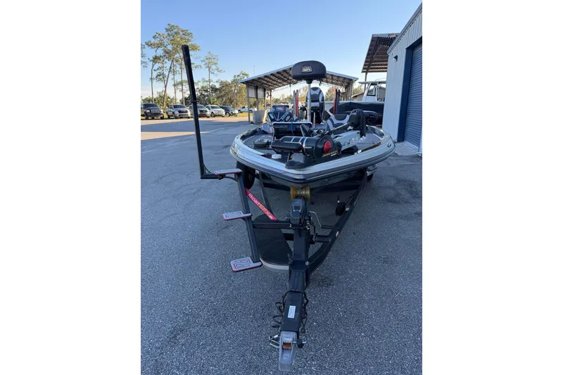 Slide: The Image of 2018 Ranger Z520L boat with dual red power poles and covered engine. - 5