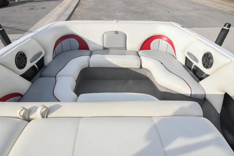 Slide: The Image of 2004 Malibu Wakesetter 23 XTi boat interior with white and red seating. - 13