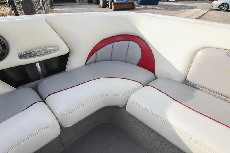 Slide: The Image of 2004 Malibu Wakesetter 23 XTi boat interior with white and red seating. - 14