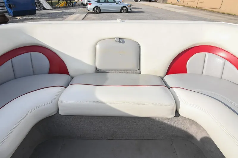 Slide: The Image of 2004 Malibu Wakesetter 23 XTi boat interior with white and red seating. - 15