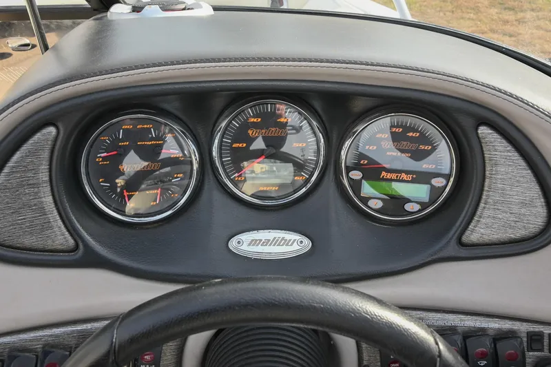 Slide: The Image of Dashboard of 2004 Malibu Wakesetter 23 XTi boat with gauges and controls. - 31