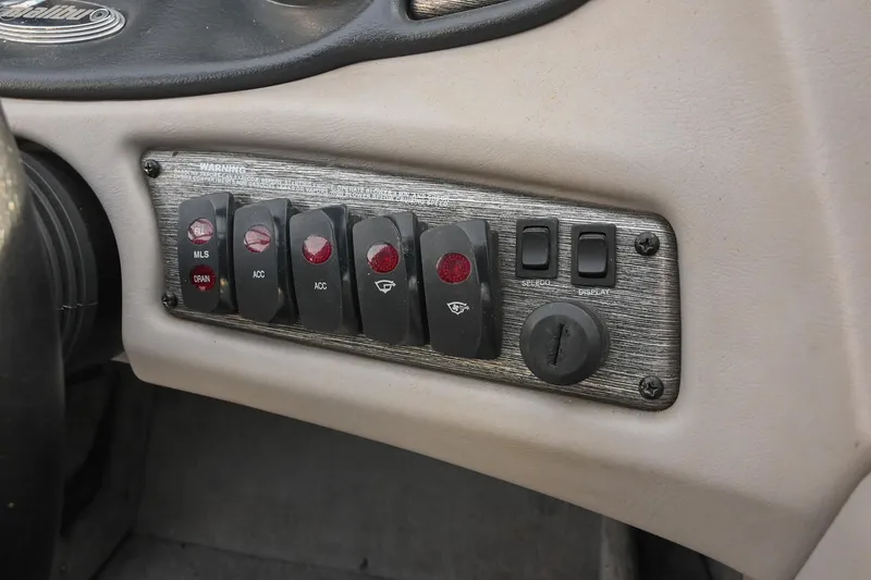 Slide: The Image of 2004 Malibu Wakesetter 23 XTi dashboard switches and controls panel. - 33