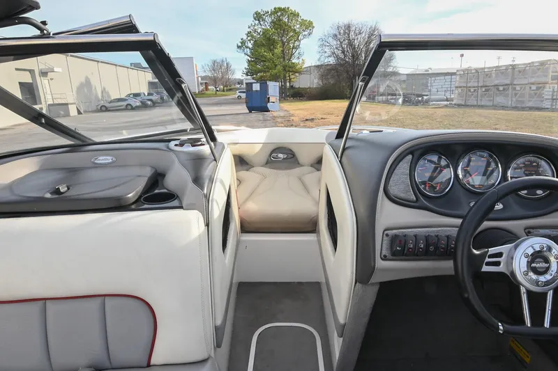 Slide: The Image of 2004 Malibu Wakesetter 23 XTi boat interior with dashboard and seating area. - 35