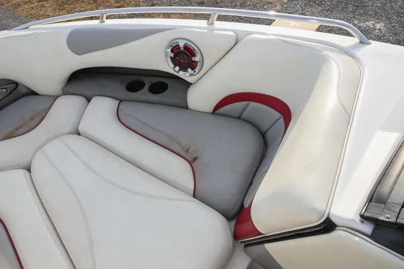 Slide: The Image of 2004 Malibu Wakesetter 23 XTi boat interior with white and red seating. - 39