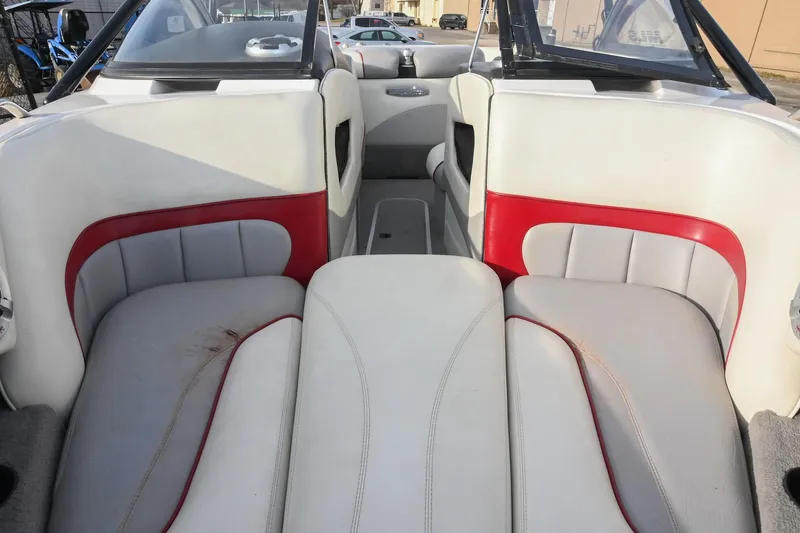 Slide: The Image of 2004 Malibu Wakesetter 23 XTi boat interior with white and red seating. - 41