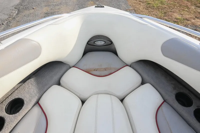 Slide: The Image of 2004 Malibu Wakesetter 23 XTi boat interior with white and gray seating. - 42