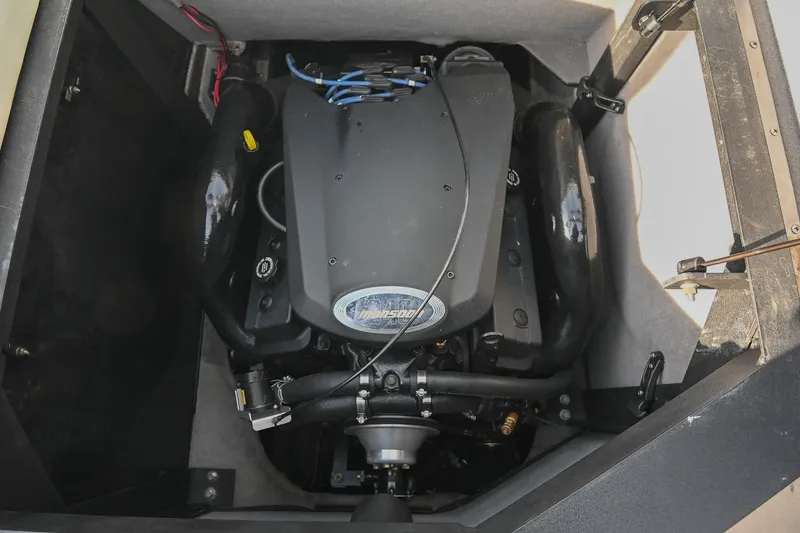 Slide: The Image of 2004 Malibu Wakesetter 23 XTi engine compartment, showcasing powerful inboard motor. - 43