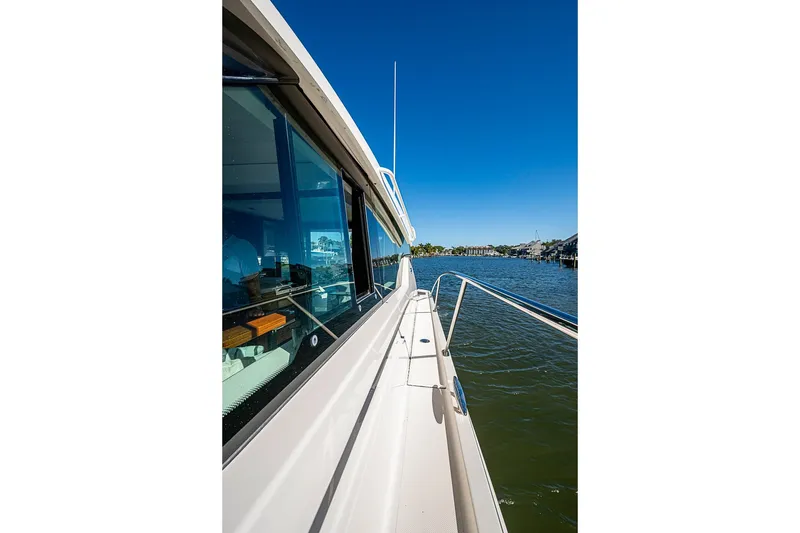 Slide: The Image of 2018 Tiara Yachts C39 Coupe on water, showcasing sleek design and scenic view. - 28