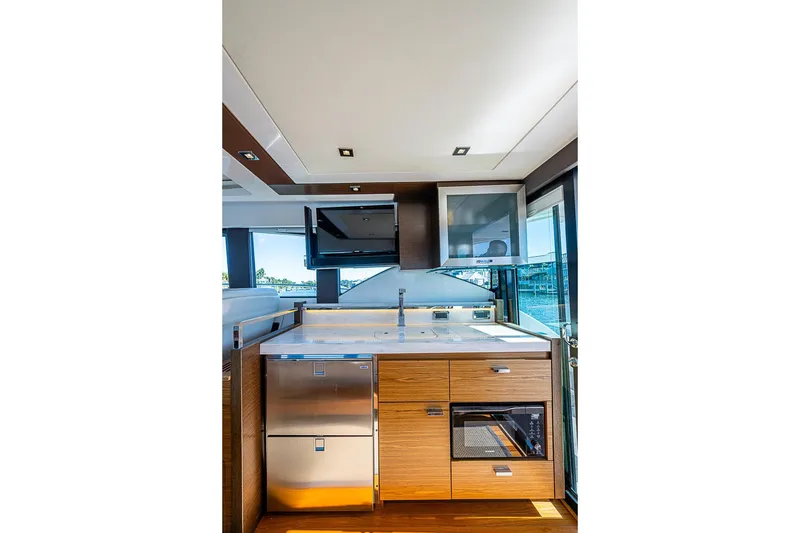 Slide: The Image of Luxurious 2018 Tiara Yachts C39 Coupe kitchen interior with modern appliances and sleek design. - 40