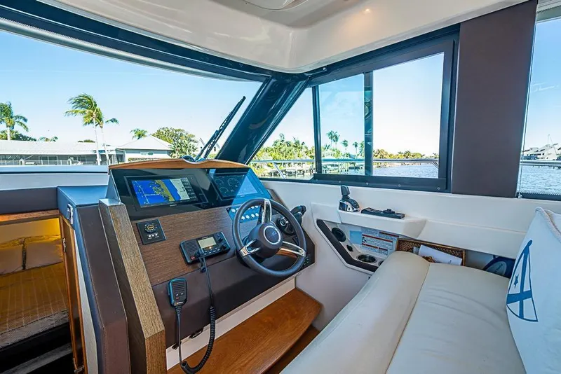 Slide: The Image of 2018 Tiara Yachts C39 Coupe helm with modern navigation system and luxurious interior. - 46