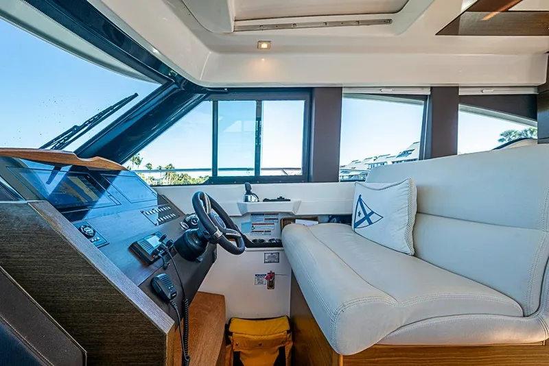 Slide: The Image of 2018 Tiara Yachts C39 Coupe interior with helm and seating area. - 47