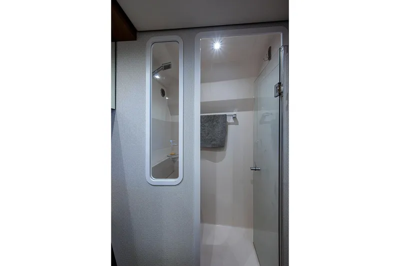 Slide: The Image of 2018 Tiara Yachts C39 Coupe bathroom with modern shower and towel rack. - 55