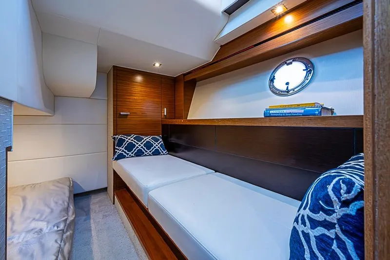 Slide: The Image of Luxurious interior cabin of 2018 Tiara Yachts C39 Coupe with cozy bedding. - 56