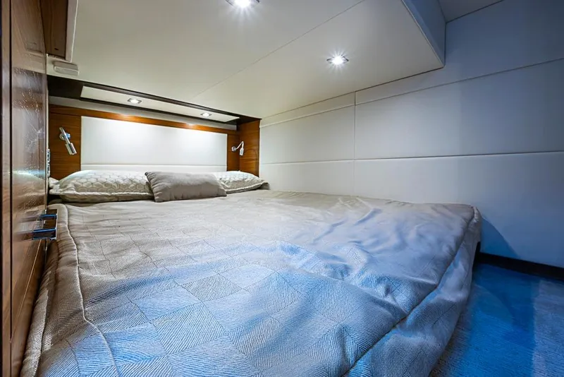 Slide: The Image of Luxurious bedroom interior of 2018 Tiara Yachts C39 Coupe with modern lighting and cozy bedding. - 57