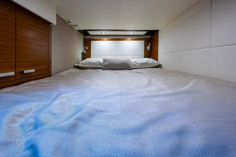 Slide: The Image of Luxurious bedroom interior of 2018 Tiara Yachts C39 Coupe with elegant bedding. - 58