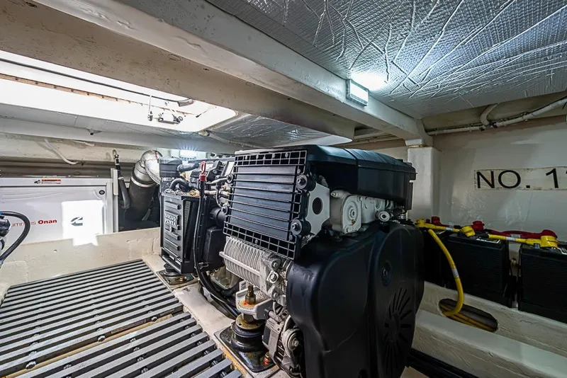 Slide: The Image of Engine room of 2018 Tiara Yachts C39 Coupe, featuring Volvo Penta engine and Cummins Onan generator. - 61