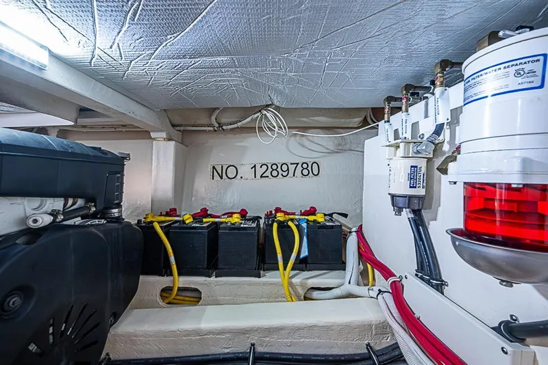 Slide: The Image of Engine room of 2018 Tiara Yachts C39 Coupe with batteries and filters. - 62