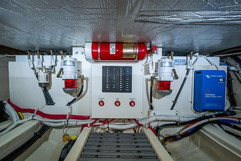 Slide: The Image of Engine room of 2018 Tiara Yachts C39 Coupe with fire suppression system and battery charger. - 66