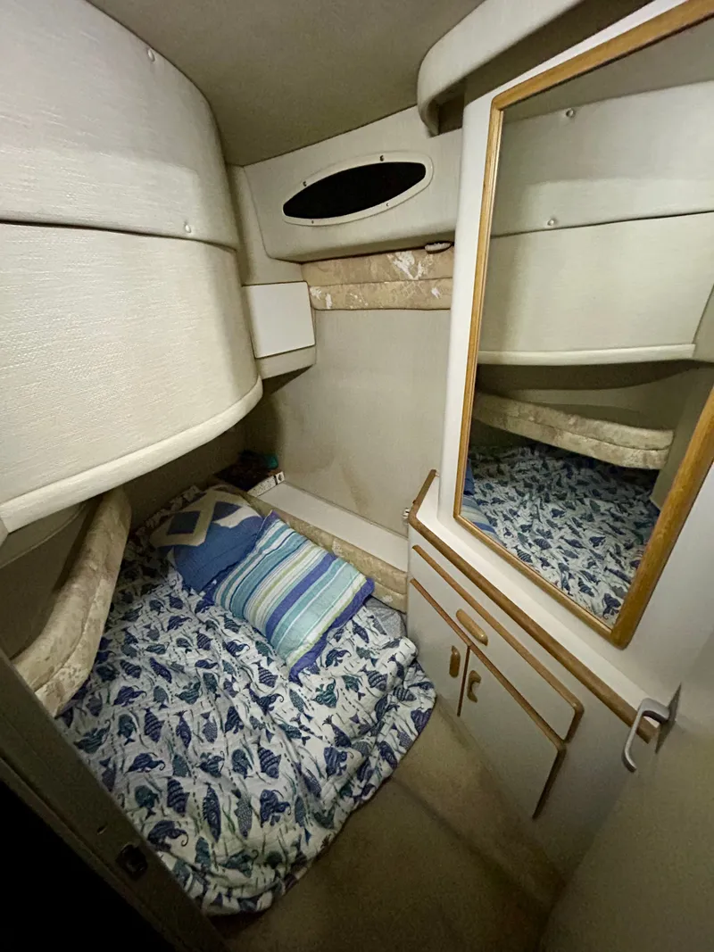 Slide: The Image of Interior of 1996 Sea Ray 370 Sedan Bridge with bed and mirror. - 18