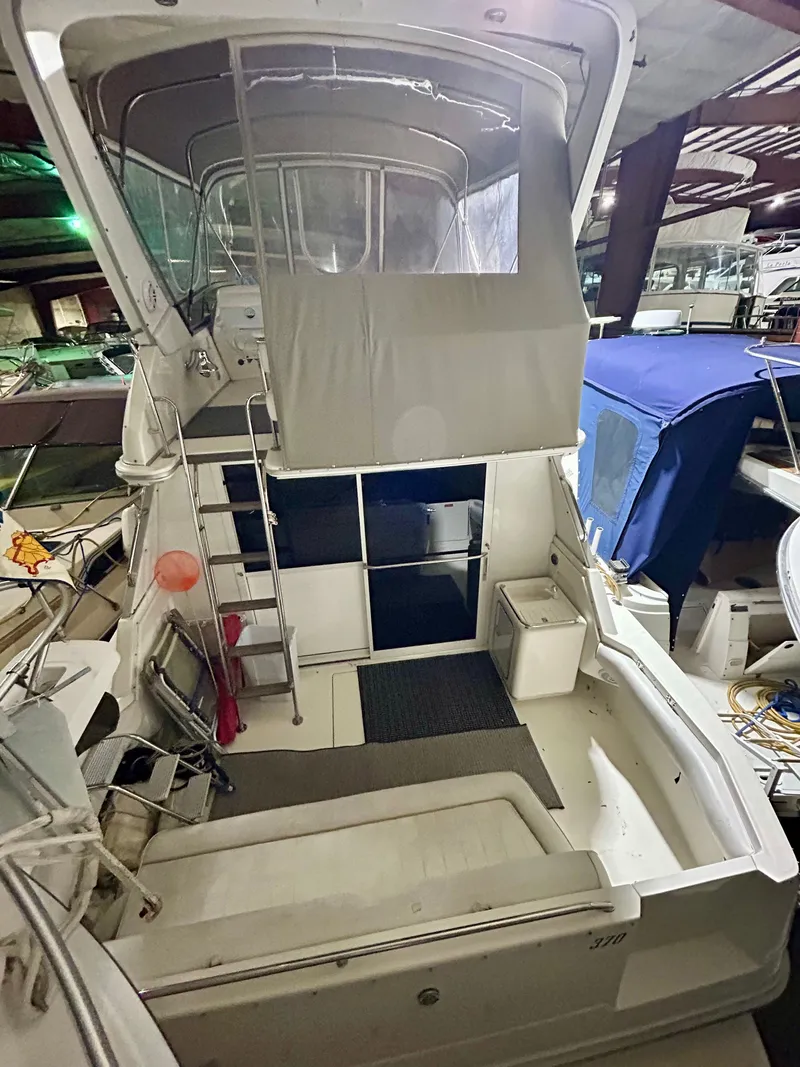 Slide: The Image of 1996 Sea Ray 370 Sedan Bridge in dock, interior view. - 23