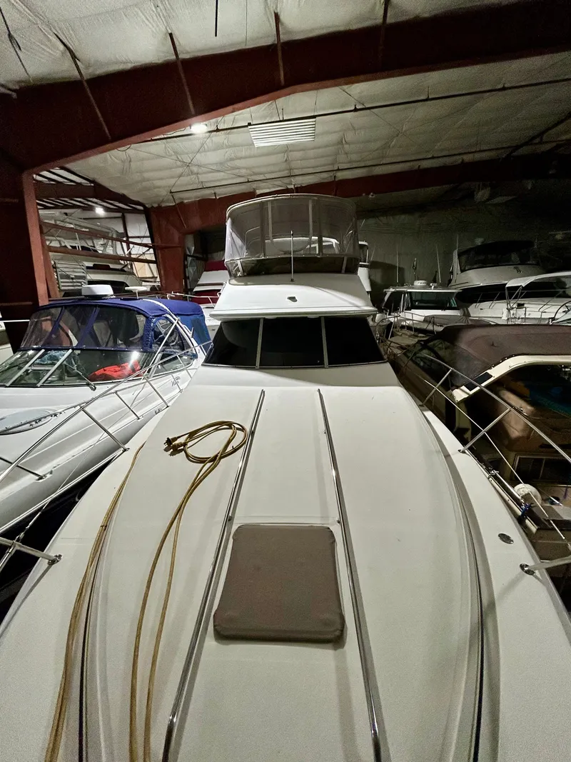 Slide: The Image of 1996 Sea Ray 370 Sedan Bridge in storage facility. - 26