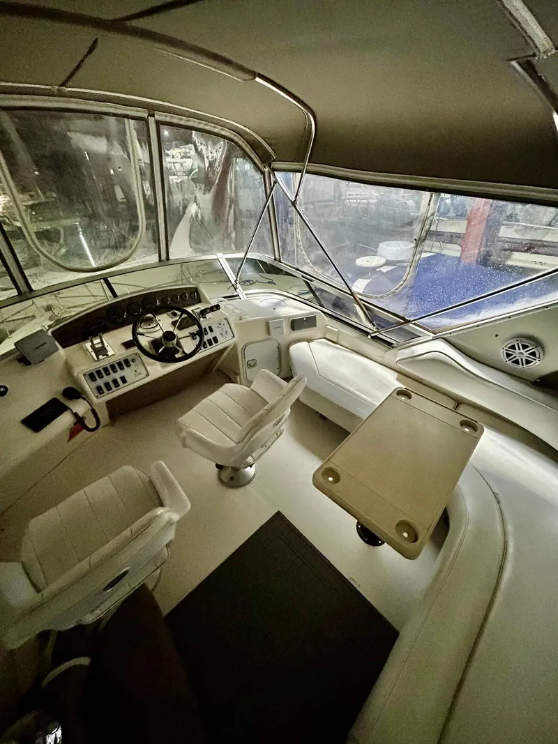 Slide: The Image of Interior of 1996 Sea Ray 370 Sedan Bridge, helm and seating area. - 6
