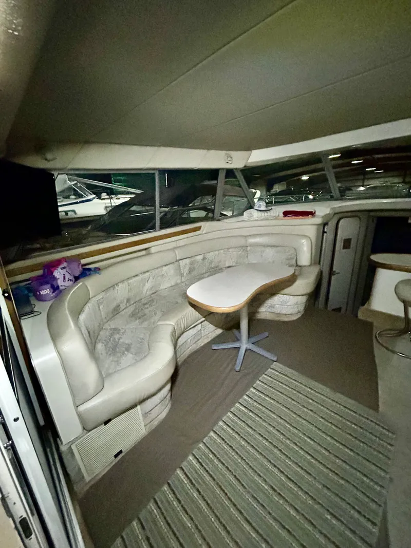 Slide: The Image of Interior of 1996 Sea Ray 370 Sedan Bridge with seating area. - 9
