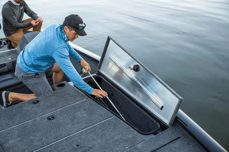 Slide: The Image of Aerial view of Rock Outdoors store with parked vehicles, including a 2020 Tracker Pro Team 195 TXW boat. - 12