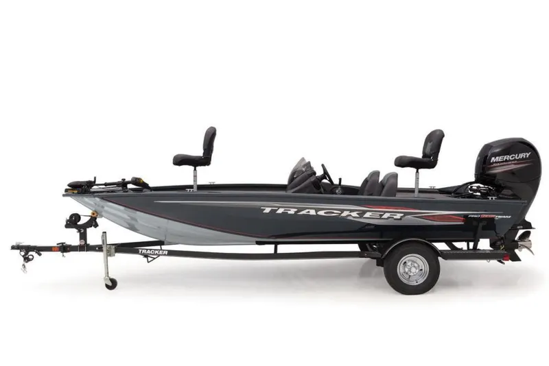 Slide: The Image of Rock Outdoors store exterior with parking lot and greenery, featuring a 2020 Tracker Pro Team 195 TXW. - 13